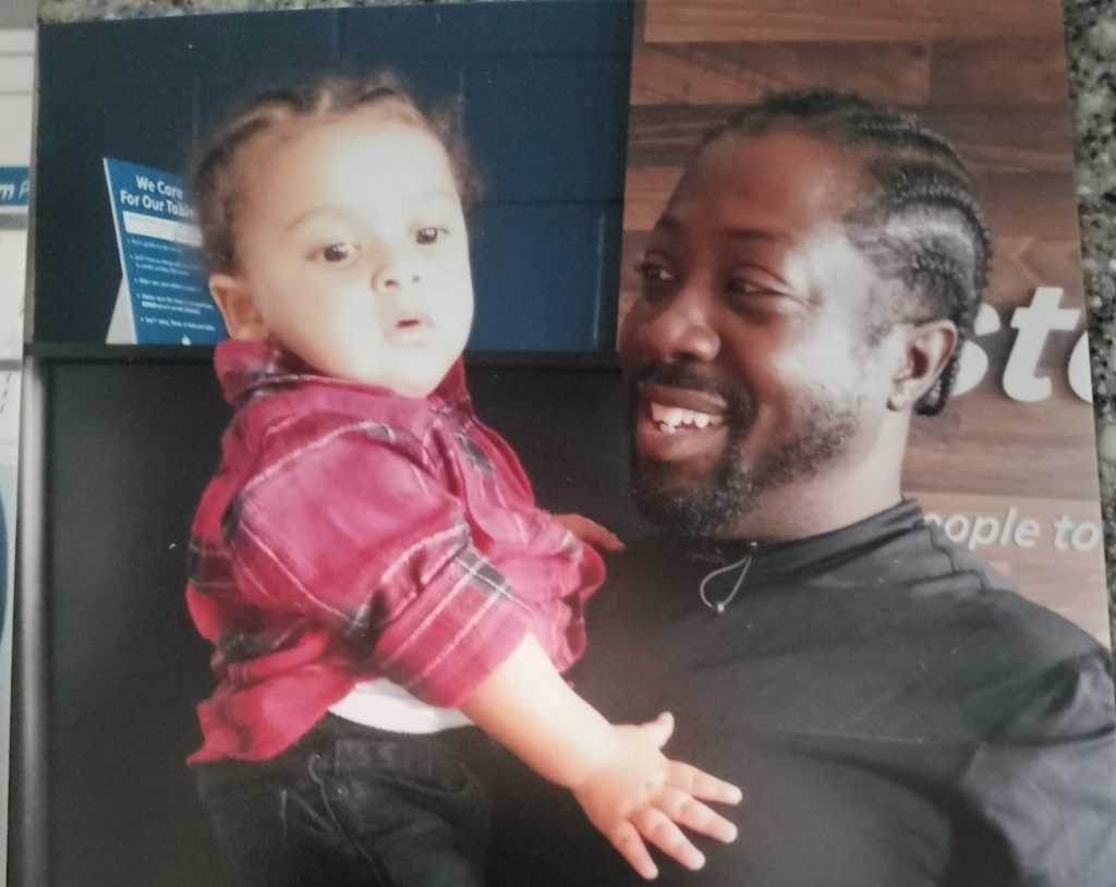 Joe holding his son King