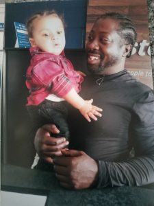 Joe holding his son King